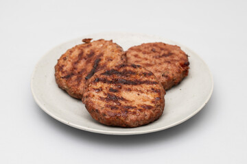 Tasty grilled hamburgers meat on plate