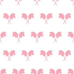 Seamless pattern of pink silhouettes of toy horse heads for hobbyhorsing © Yevheniia