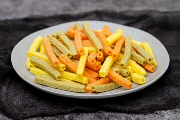 Potato vegetable chips baked with herbs on dish