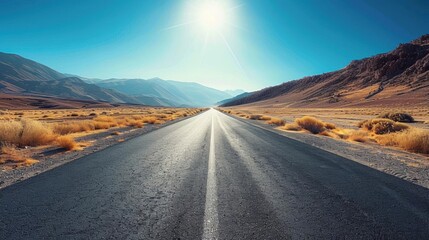 Naklejka premium Empty asphalt road, winding through vast desert, clear blue sky, wideangle shot, bright sunlight, crisp details