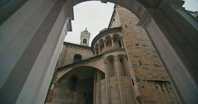 Bergamo's Santa Maria Maggiore Cathedral: A Journey Through Historic Arches, Detailed Frescoes, and Vibrant Urban Scenes. High quality 4k footage