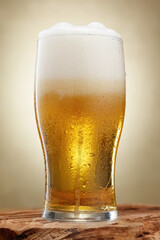 Glass of fresh and cold beer with drops. Craft beer. Beer. Shallow depth of field