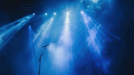 Obraz premium dramatic stage spotlight with smoke in blue hues live music event ambiance concert photography