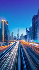 Obraz premium Busy freeway at night with headlights illuminating the road. Light trails from speeding cars leading to a futuristic city skyline, highlighting the energy and motion of urban life.