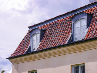 Low angle view of a building against cloudy sky