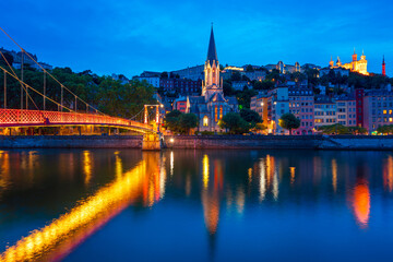Lyon, France. View at night of the Vieux Lyon District and the Fourviere Hill on the right side of the Saone River