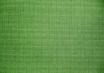 close up green color fabric texture. fabric herringbone,zigzag, chevron pattern. upholstery or drapery abstract textile fabric background for design.