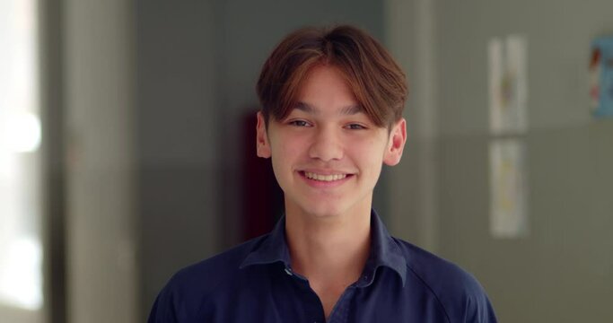 A happy smile of a handsome male high school student who is half Asian-European.