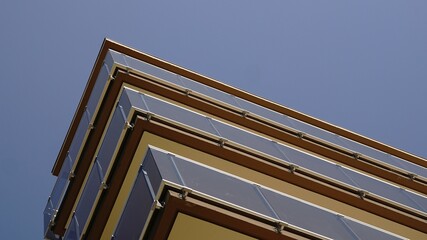 low angle of overhanging balconies facing the sky