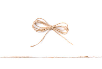 Linen rope string with bow isolated on white, top view