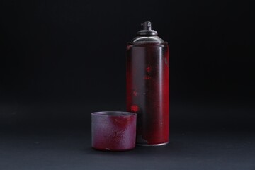 Obraz premium One spray paint can with cap on dark background