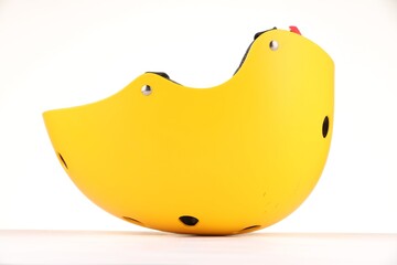 One yellow protective helmet isolated on white