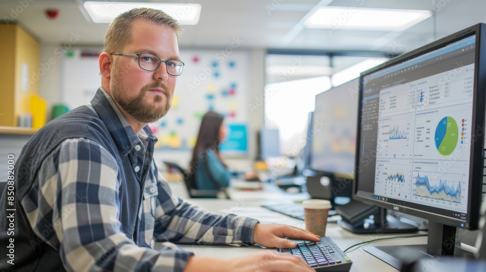 Poster a man is sitting in front of a computer monitor with a keyboard in front of him