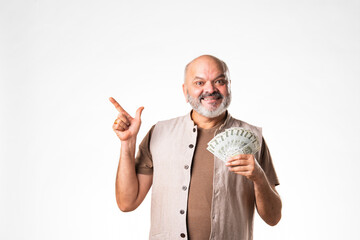Indian asian senior retired old man holding money fan against white background