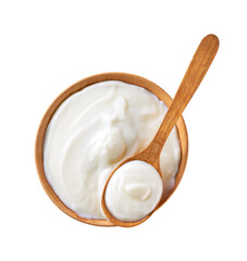 natural organic yogurt in a wooden bowl with spoon isolated on a white background, top view.