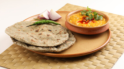 Multigrain Roti or millet flat bread.Made with chana ,caun, green moong , udad ,ragi , Jowar  farmer's lunch Indian bread with chickpea powder curry