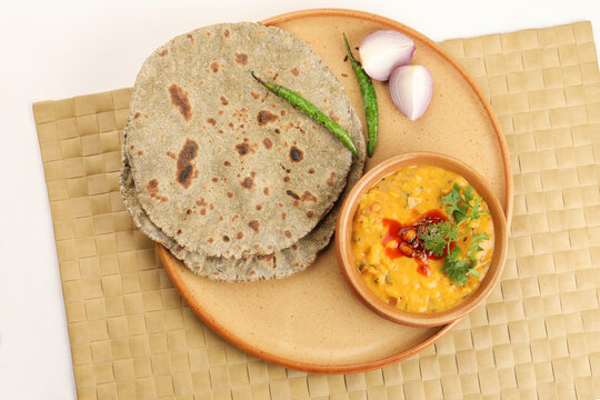 Multigrain Roti or millet flat bread.Made with chana ,caun, green moong , udad ,ragi , Jowar  farmer's lunch Indian bread with chickpea powder curry