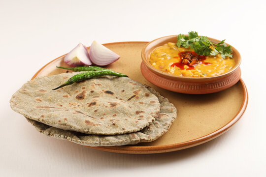 Multigrain Roti or millet flat bread.Made with chana ,caun, green moong , udad ,ragi , Jowar  farmer's lunch Indian bread with chickpea powder curry