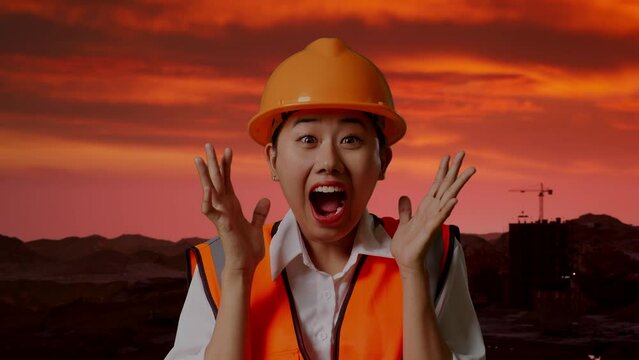 Close Up Of Asian Female Engineer With Safety Helmet Smiling To Camera And Saying Wow While Standing at Construction Site, Mining Machinery