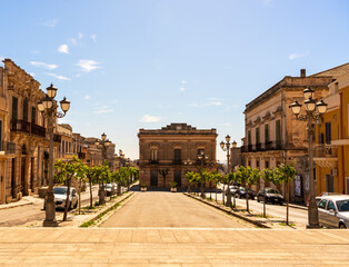the square in front of Basilica of the Santissima Annunziata under a sunny blue sky, in Ispiuca RG,...