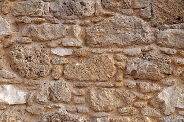 ancient stone wall closeup for natural beige vintage background