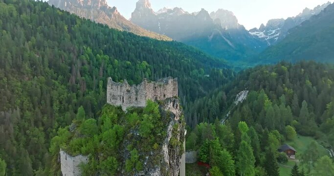 Aerial view of Castel belfort in Dolomite Alps, Italy. Croissant ruins of an ancient building in a mountain landscape, tourist Europe. High quality 4k footage