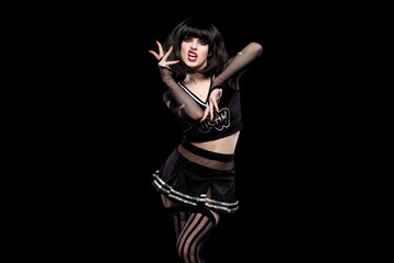 Portrait of beautiful goth punk model in studio on black background