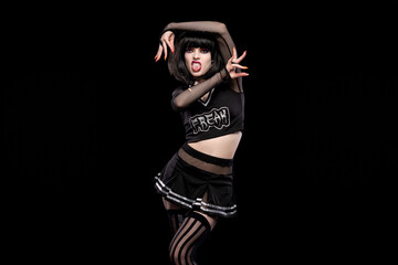 Portrait of beautiful goth punk model in studio on black background