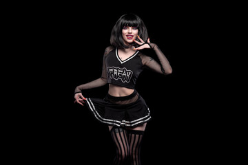 Portrait of beautiful goth punk model in studio on black background