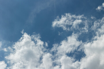White clouds on a bright blue sky