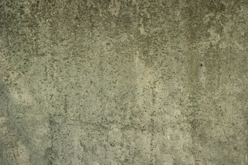 Gray concrete wall with rough texture and dirt on it