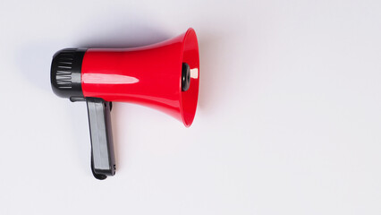 Red megaphone isolated on white background..