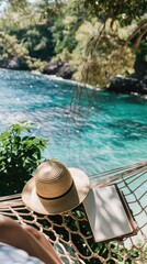 Obraz premium a straw hat, sunglasses, and notebook lying on a hammock in front of an open sea with lush greenery, with a blurred background to highlight these travel accessories.