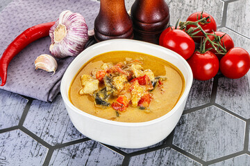 Traditional yellow Thai curry with chicken