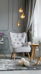 a living room interior featuring a modern grey sofa, armchair, and coffee table, decorated with flowers against a white wall background.