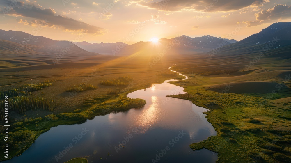 Wall mural stunning aerial view of a tranquil sunset casting golden hues over a calm lake with majestic mountai - Wall murals