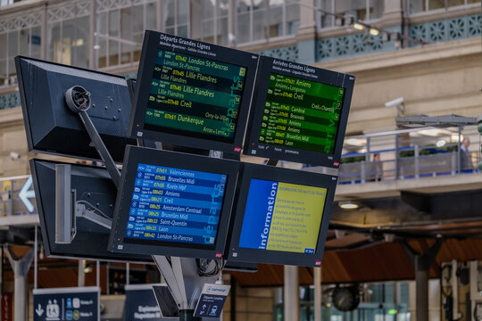 Paris, France - May 17, 2024 : View of arrival and departure screens of high-speed trains and the Eurostar trains and crowds of people at the Rail station Gare du Nord, Paris France