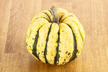 Ripe raw fresh decorative pumpkin