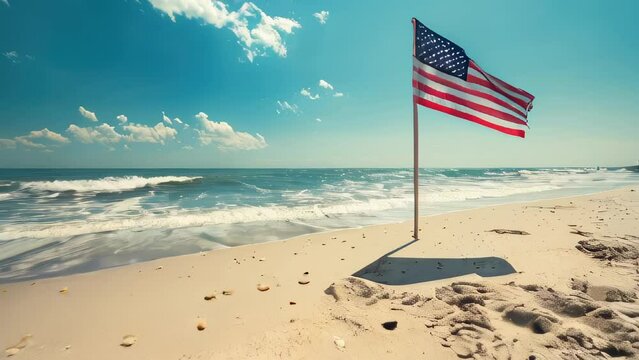 American flag on sandy beach by ocean waves under clear sky
