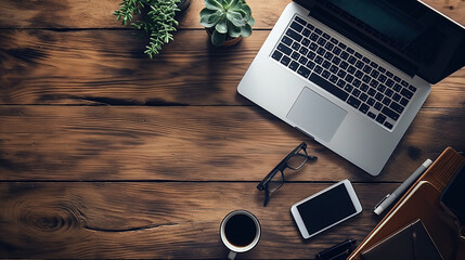 Office desk with laptop smartphone and coffee on wooden table