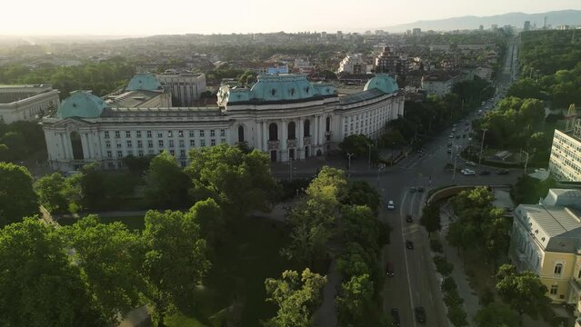 Aerial drone shot of the old town in Sofia, Bulgaria at sunrise. Eastern Europe. The city center buildings and boulevards as seen from above during sunrise.
