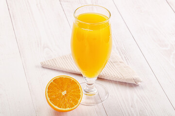 Sweet fresh orange juice in the glass