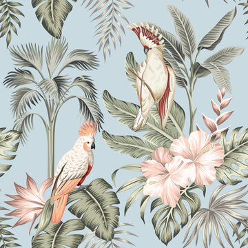 Tropical vintage palm leaves, pink hibiscus flower, pink cockatoo parrot floral seamless pattern blue background. Exotic jungle wallpaper