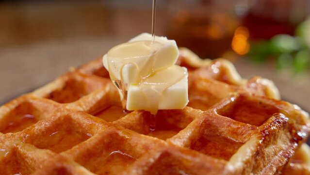 Classic Belgian waffles with syrup. Concept of classic breakfast, comfort food, sweetness