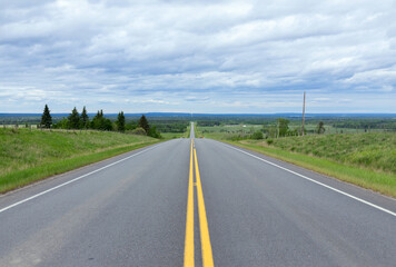 Scenic view from the highway with yellow solid lines in plains.