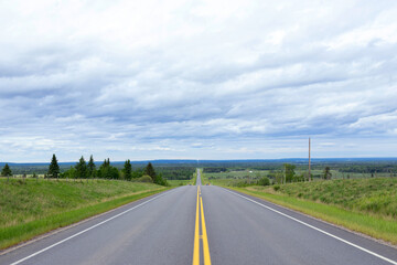 Scenic view from the highway with yellow solid lines in plains.