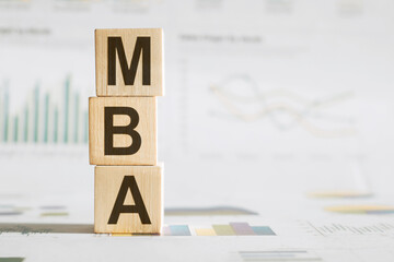 A wooden block featuring the letters MBA, representing the abbreviation for Master of Business...