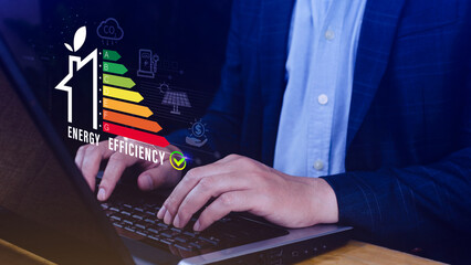 Energy efficiency concept, Businessman touching virtual screen of energy efficiency rating for...