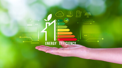 Energy efficiency concept, Businessman touching virtual screen of energy efficiency rating for...