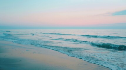 Tranquil seascape at dawn pastel blue and pink hues